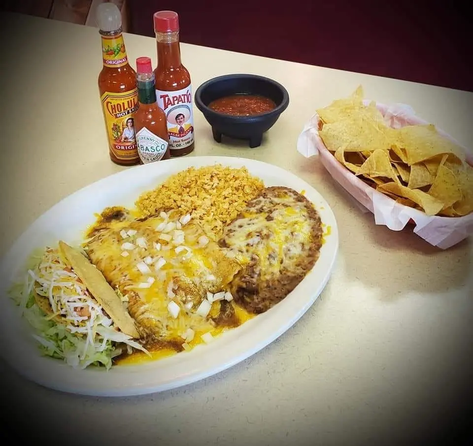 Enchilada combination plate with rice and beans